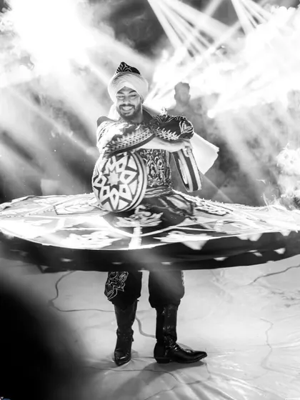 Beyond the music, I love incorporating stunning visual performances. This powerful black and white photo captures a Tanoura dancer in mid-spin, a beautiful and mesmerizing act that adds a touch of artistic elegance to a wedding celebration.