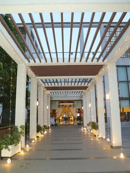 The beautifully lit entrance walkway for the 25th-anniversary party at M3M Golf Estate.