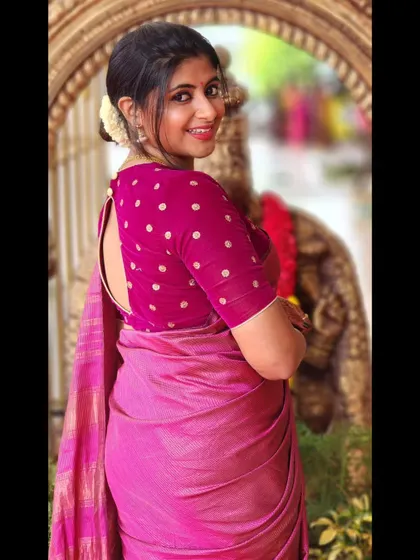 A playful pose in a pink saree. I love how traditional wear can be both elegant and fun.