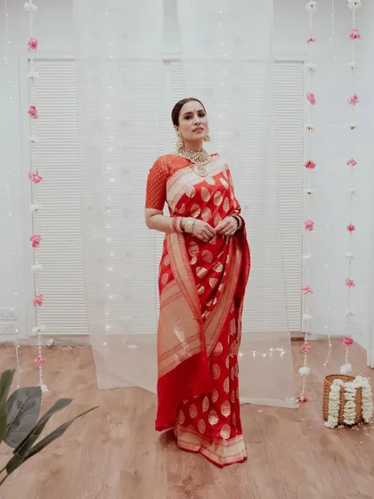 For this project, I recreated Anushka Sharma's iconic wedding reception look, featuring a classic center-parted sleek bun and a traditional red saree.