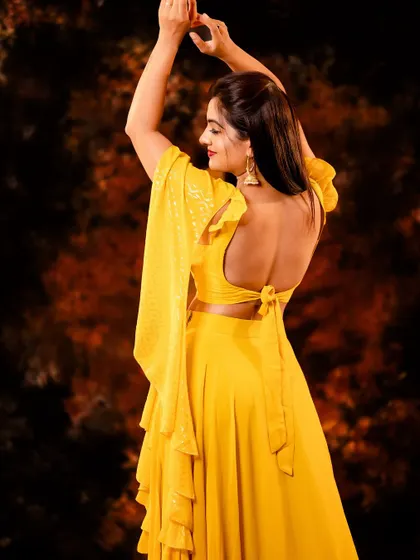 A back view of the yellow outfit, showing the design details and the model's pose. It adds variety to the series.