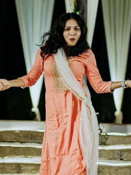 A choreographer leading the dance practice, ensuring every performance is perfect. I coordinate with all vendors to make your event flawless.
