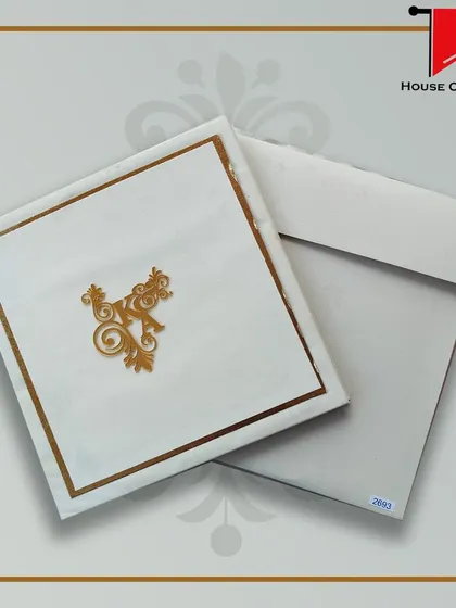 A luxury invitation in clean white and gold. The minimalist design is elevated by the high-quality paper and the elegant gold foil monogram.