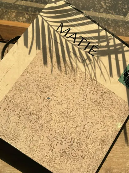 A sunny afternoon spent browsing our 'MATIÉ' Collection. This catalog features unique and modern wallpapers, perfect for creating a contemporary and stylish home.