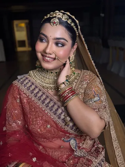 Another angle of this stunning bride, showing how the makeup looks from the side. The contouring is soft and natural, enhancing her features beautifully.