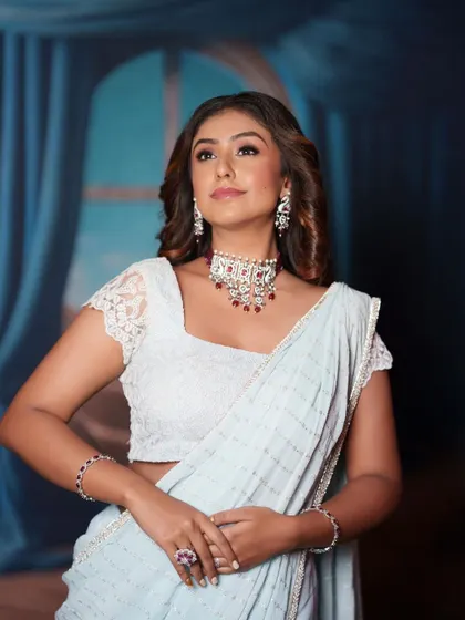 The model looks chic and ready for any party or reception in this stylish look.