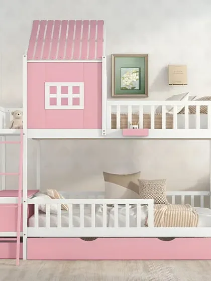 An adorable pink and white bunk bed with a house-shaped facade on the top bunk.