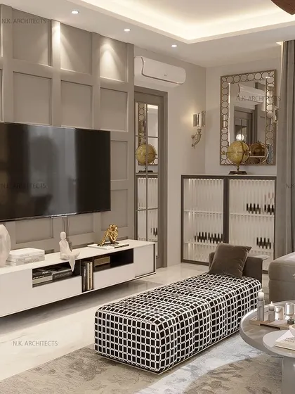 Simplicity and elegance define this living space. The highlight is a stylish bar with fluted glass, which complements the modern furniture and the calm, neutral color palette.