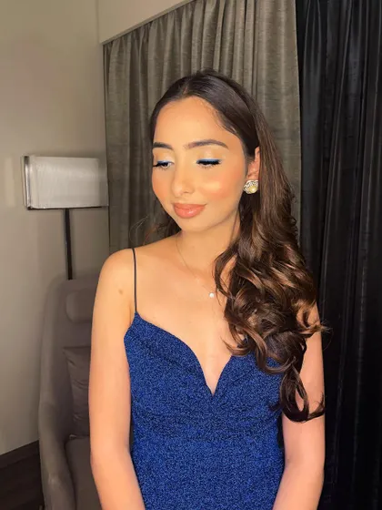 A close-up of the clean eye makeup, showing a hint of blue liner to tie in with the dress.