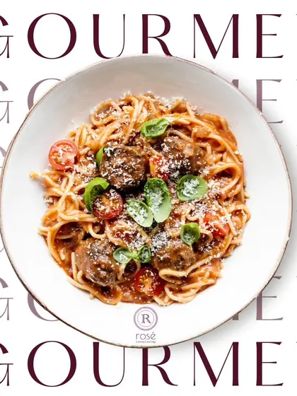 A gourmet dish of spaghetti with meatballs, beautifully plated. This shows our versatility in creating high-end versions of beloved comfort foods from around the world.