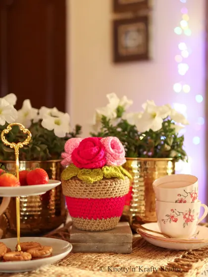 The Rosie Posie, seen here with a stack of teacups, ready for a chat with a friend.
