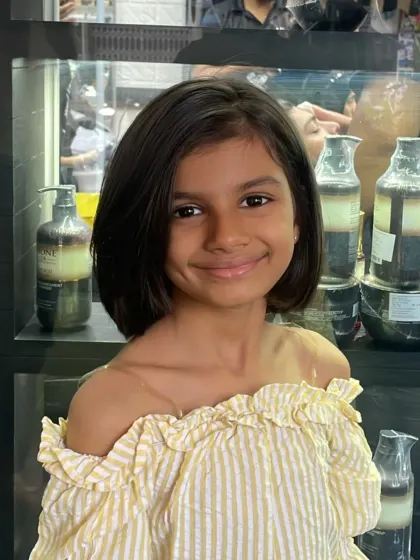 A perfect short bob for this young client. This hairstyle is not only cute and stylish but also practical and easy for kids to manage.
