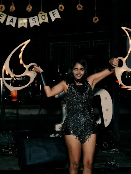 A final shot from the Shadowfax event, holding the unlit fire fans. Even before they are lit, the props themselves have a strong visual presence.