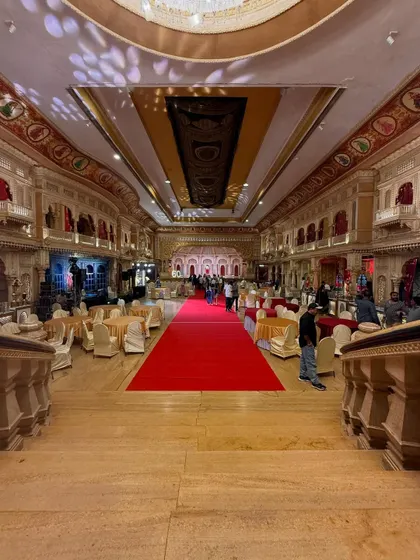 The grand entrance and red carpet for a milestone birthday party. My lighting setup, including the subtle patterns on the ceiling, enhances the luxurious feel of the event.