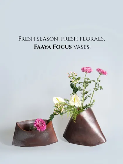 A fresh season calls for fresh florals. These unique, folded metal vases in a burnished copper finish have an organic, almost leather-like appearance, providing a warm and unconventional home for spring flowers.