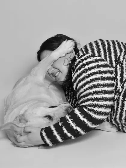 Playful, candid moments are just the best. This black and white shot captures a fun, goofy interaction between a mom and her dog, showing their true relationship.