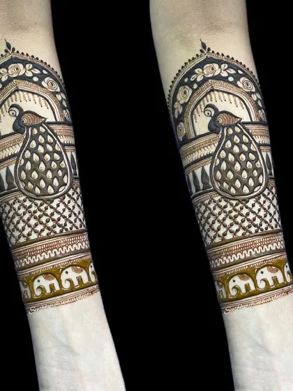 Another variation of the peacock and elephant arm band, showing how I can customize motifs for you.