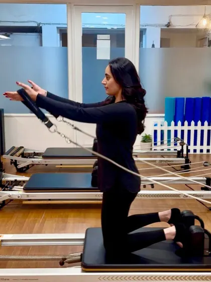 Various shots of members and instructors in action during our dynamic Reformer Pilates classes.