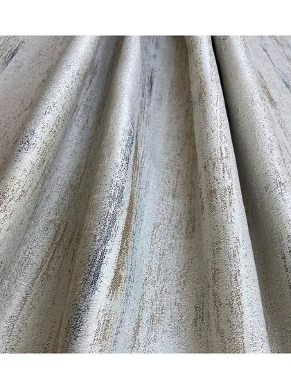 The 'Dry Brush' fabric has a subtle, sophisticated, and painterly look. Its texture mimics brushstrokes, adding an artistic and elegant touch to upholstery or drapery.