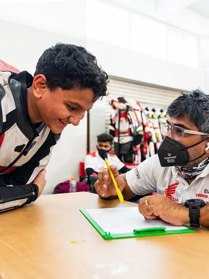 One on one feedback is crucial for development. Here, I am reviewing track data and performance with a young rider, helping him understand where he can improve and build on his natural talent.