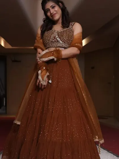 A full-length photo in a traditional lehenga for a special occasion. I enjoy celebrating life's moments.