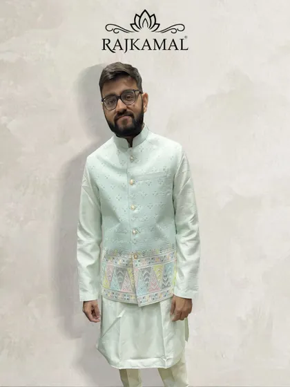 A client looking happy and comfortable in my pastel green kurta paired with a lightly embroidered jacket. This is an ideal outfit for a daytime event or a smaller ceremony.