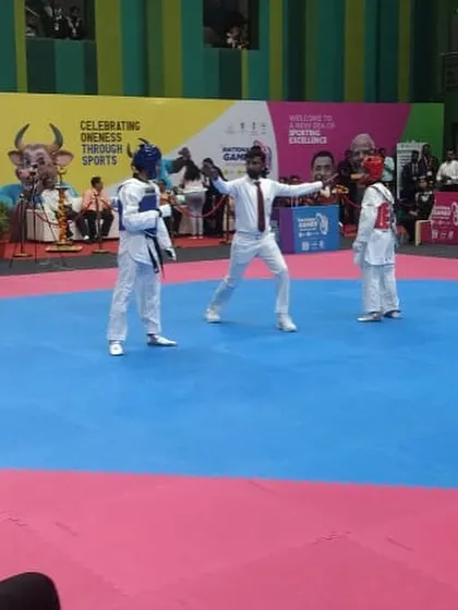Here I am officiating a match at the 37th National Games. This role requires intense focus and a complete understanding of the sport's regulations.