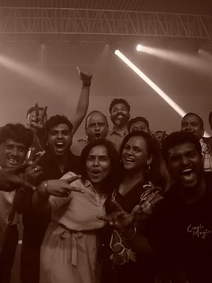 A group of colleagues celebrating together at 'The Next Orbit' party. My music brings people together and creates a fun, shared experience outside the office.