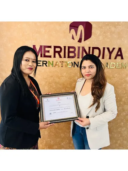 Presenting a certificate to a deserving student. It's a privilege to guide talented individuals and help them achieve their dreams.