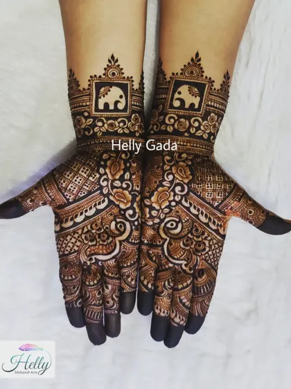 A close-up of the elephant cuff design. The negative space makes the elephant motif stand out beautifully, framed by floral borders. This is a great option for a bridesmaid or family member.