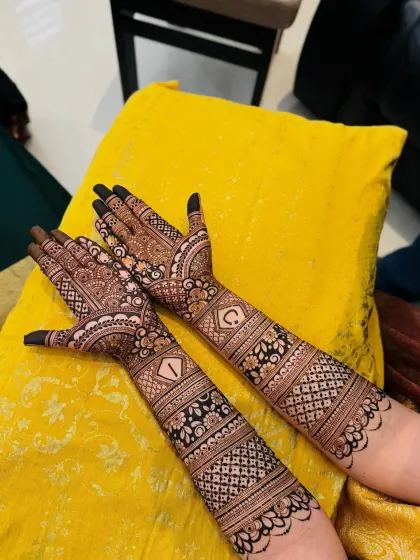 A different angle of the initialed bridal mehndi, showing how it looks in a natural setting. The design is clear, sharp, and made to last through your wedding celebrations.