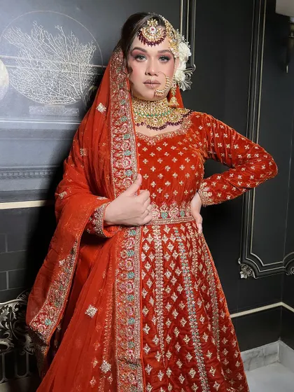 A full-length view of the orange velvet Anarkali, perfect for a bride who wants comfort and style.