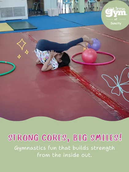 Strong cores, big smiles. This student practices a plow pose, a gymnastics drill that builds core strength and spinal flexibility, essential for more advanced moves.