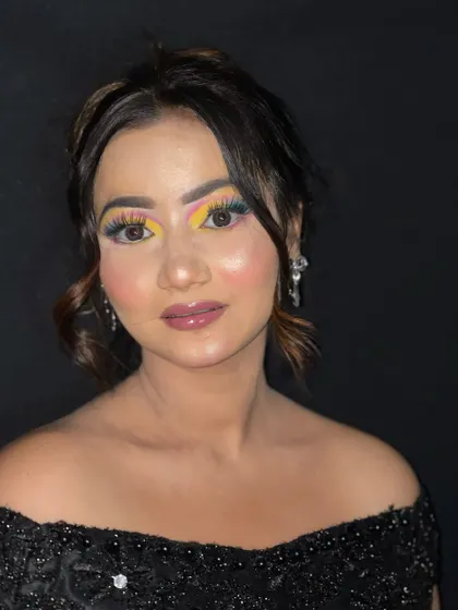 A direct look at the camera, showing the symmetry and blend of the colorful eyeshadow.
