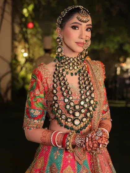 A final look at this stunning bride. The makeup, hair, and styling all work in harmony to create a look that is both regal and deeply rooted in Indian tradition.