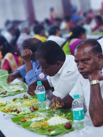 Guests savoring their meal at a wedding we catered. The focus is on the food and the communal dining experience.