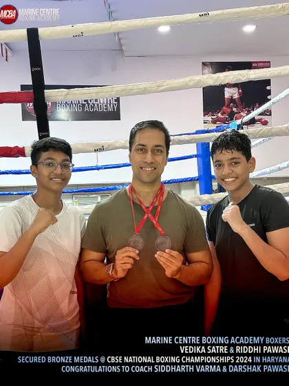 Academy owner Devraj Das with our two national bronze medalists, Vedika and Riddhi.