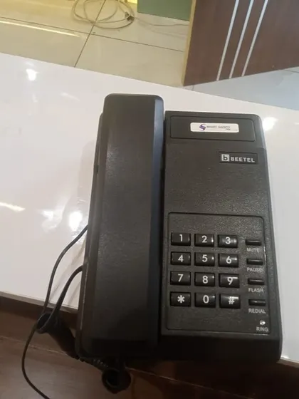 A Beetel phone placed on a clean, white office counter, part of a recent multi-extension installation.
