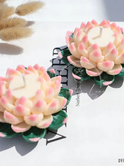 My new Lotus candle, designed especially for the Diwali collection. This one features a beautiful two-tone design with pink-tipped petals and a creamy white center, resting on green leaves.