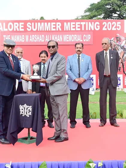 Mr. Nawab Shafat Ali Khan presents The Nawab M Arshad Ali Khan Memorial Cup to the owners of Champions Way.