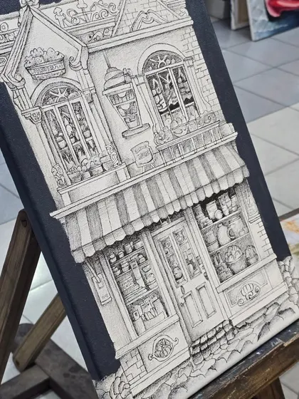 Precision and patience are key in our micron pen classes. This detailed architectural drawing on canvas showcases the intricate line work and perspective skills our students develop.