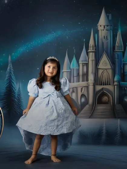 Every child deserves to feel like royalty in their own fairy tale. With this magical castle backdrop, I can transform your little one into their favorite princess, like Elsa in her starlit kingdom.