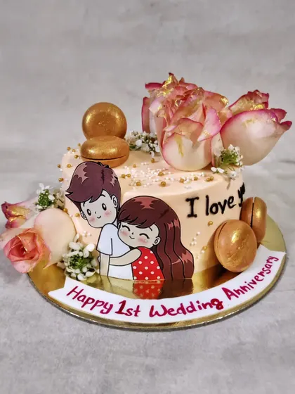 One year down, a lifetime to go! I absolutely adore making first anniversary cakes like this one, featuring a cute couple topper, fresh roses, and golden macarons.