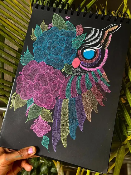 A wise owl decorated with floral patterns and colorful feathers, created using the stippling technique. This piece brings a touch of wisdom and vibrant nature to your walls.