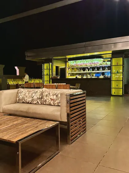 A close-up of the custom-made outdoor furniture, featuring a combination of wood and metal frames that are both stylish and durable for outdoor use.