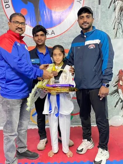 Presenting a gift to Naysha to celebrate her national-level achievement. Her hard work inspires everyone at the academy.