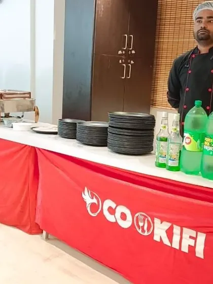 A dedicated beverage counter with a variety of soft drinks, an essential part of our complete party catering package.