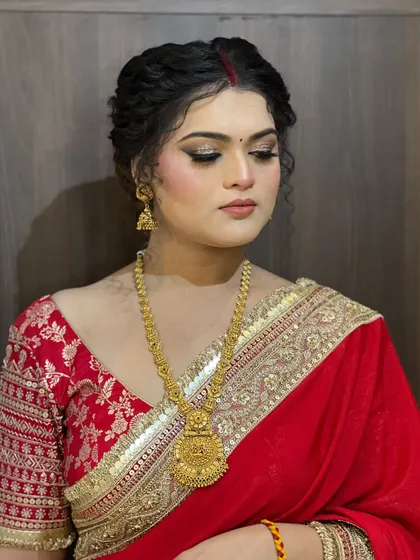 A serene shot with eyes closed, showcasing the detailed eye makeup and the classic simplicity of the look.
