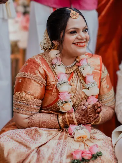 The joy of a bride on her special day is what I love to capture. This South Indian bridal look features radiant skin and a happy, bright smile, with makeup that enhances her natural beauty during the wedding ceremony.