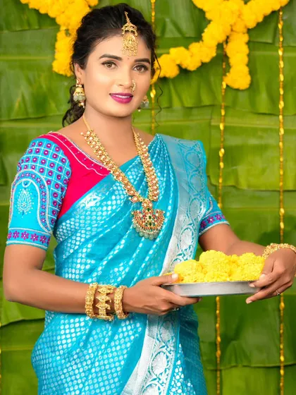 A full-length view of the model in her festive attire, looking bright and beautiful.